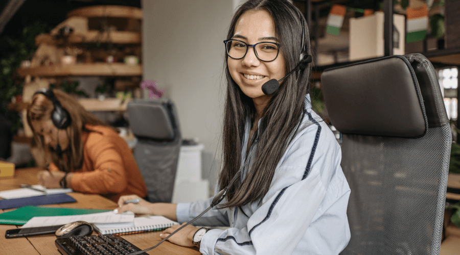 Student wearing a headphone and smiling