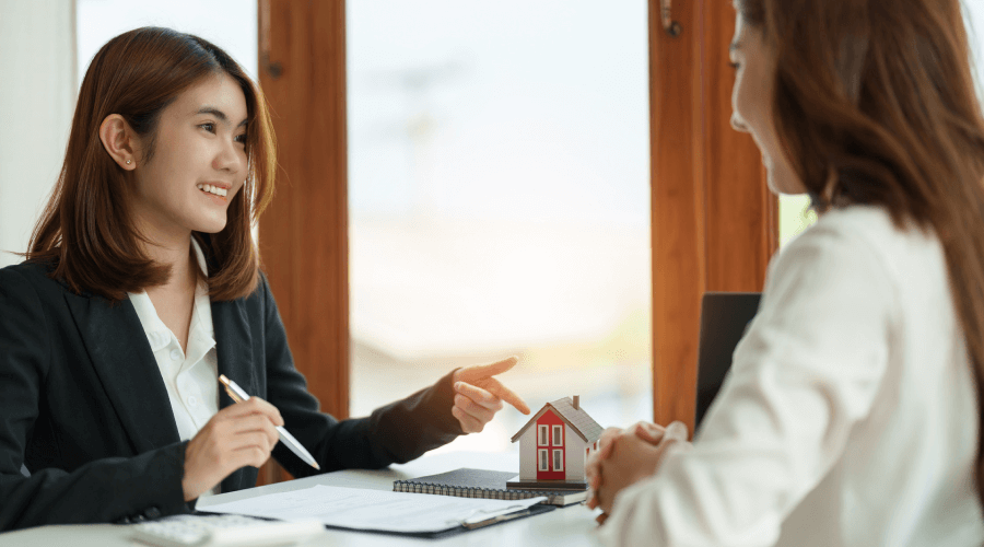 A woman explaining their services to a new student